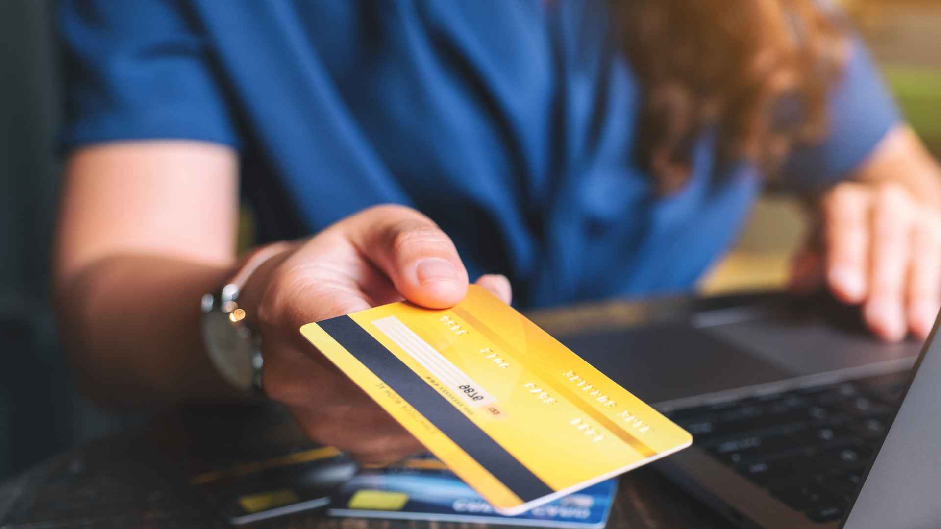 Woman Holding Credit Card